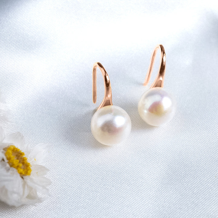 Boucles d'oreilles élégantes en perles d'eau douce rondes WE00483