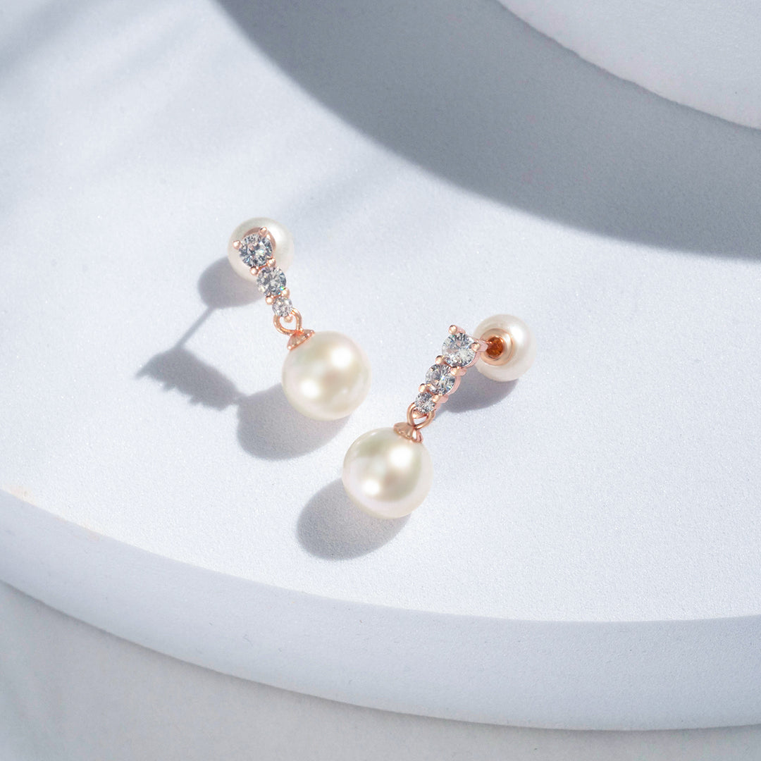 Elegantes aretes de perlas de agua dulce WE00442