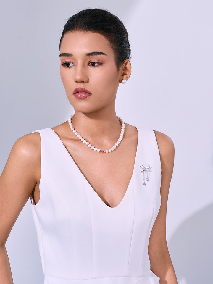 Collier et broche de perles d&