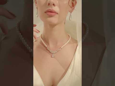 Elegantes aretes de perlas de agua dulce WE00347