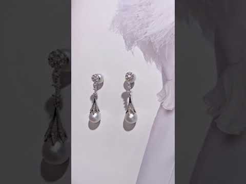 Elegantes aretes de perlas de agua dulce WE00538