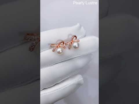 Elegantes aretes de perlas de agua dulce WE00275