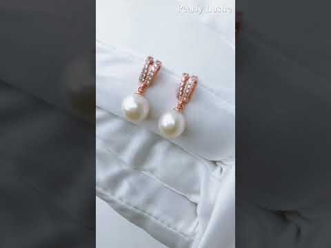 Elegantes aretes de perlas de agua dulce WE00384