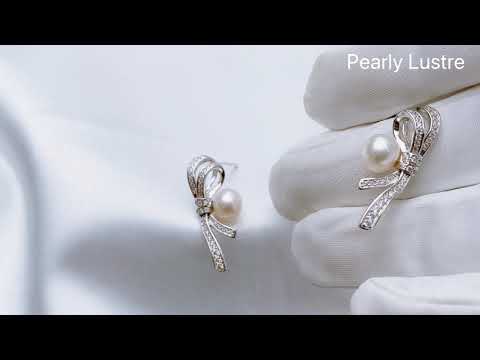 Elegantes aretes de perlas de agua dulce WE00156