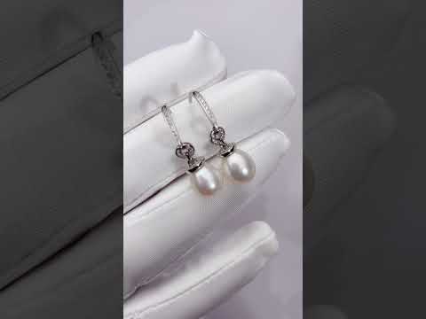 Elegantes aretes de perlas de agua dulce WE00263