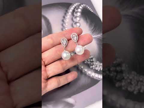 Elegantes aretes de perlas de agua dulce WE00130