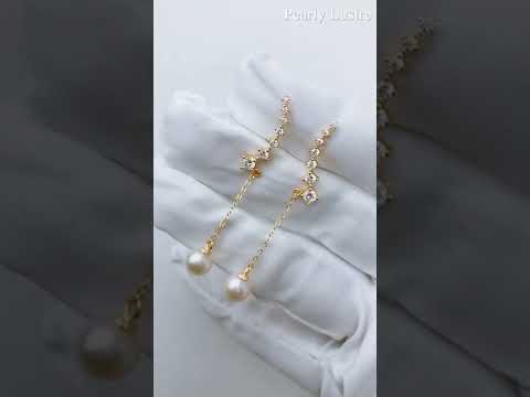 Elegantes aretes de perlas de agua dulce WE00445